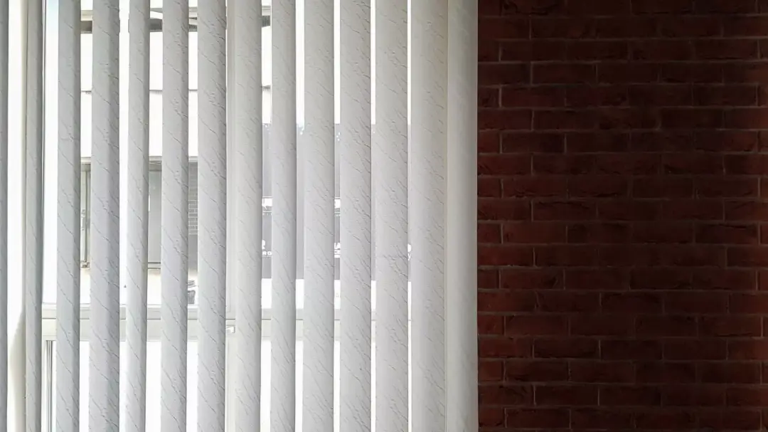 Vertical blinds across a wide patio door opening